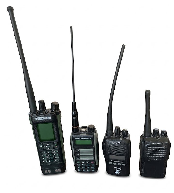 Four handheld radios on a table, numbered 1 to 4 from left to right: Baofeng UV-32, Baofeng UV-16, Vratvark 2.0 and Baofeng 888S (V6)